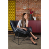 Salonowy fotel Otilia Stand Velvet z welurową poduszką
