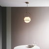 Zwisowa lampa art deco łuk L&-190844 Light& kula mosiądz