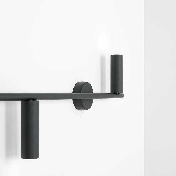 Minimalistyczna lampa ścienna Trevo 1104Y1 do salonu czarna