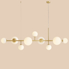 Podwieszana salonowa lampa Dione 1092N40 Aldex balls nad stół złota
