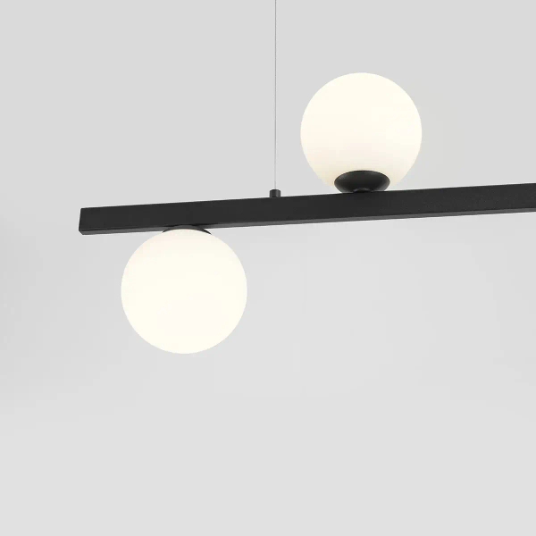 Wisząca lampa salonowa Libra 1099F1 Aldex listwa z kulami czarna biała
