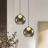 Lampa szklana wisząca nad wyspę Brin 31-38333 ball do sypialni przydymiona