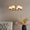 Lampa wisząca nad stół Bombazine BOM0635 do jadalni kule mosiądz