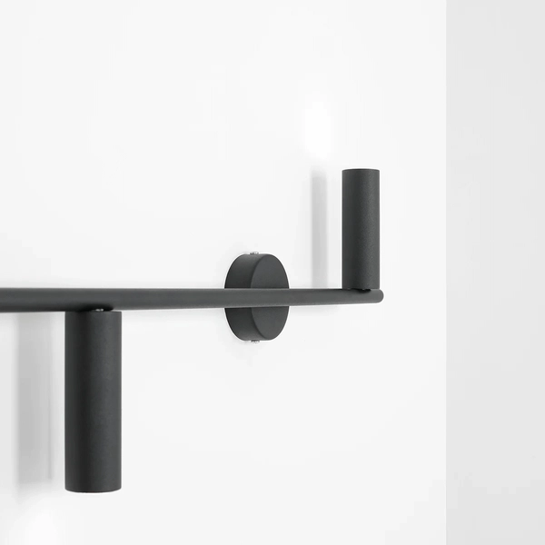 Minimalistyczna lampa ścienna Trevo 1104Y1 do salonu czarna