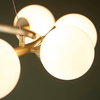 Molekułowa lampa wisząca L&-1106008 nad stół mosiądz biały
