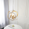 Nowoczesna lampa świecznikowa L&-191922 Light& zwis biała złota
