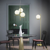 Modernistyczna LAMPA podłogowa NYXIS DL108402000 Trio metalowa OPRAWA stojąca szklana kula mosiądz biała