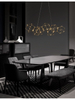 Designerska lampa wisząca Asis druciana do salonu złota